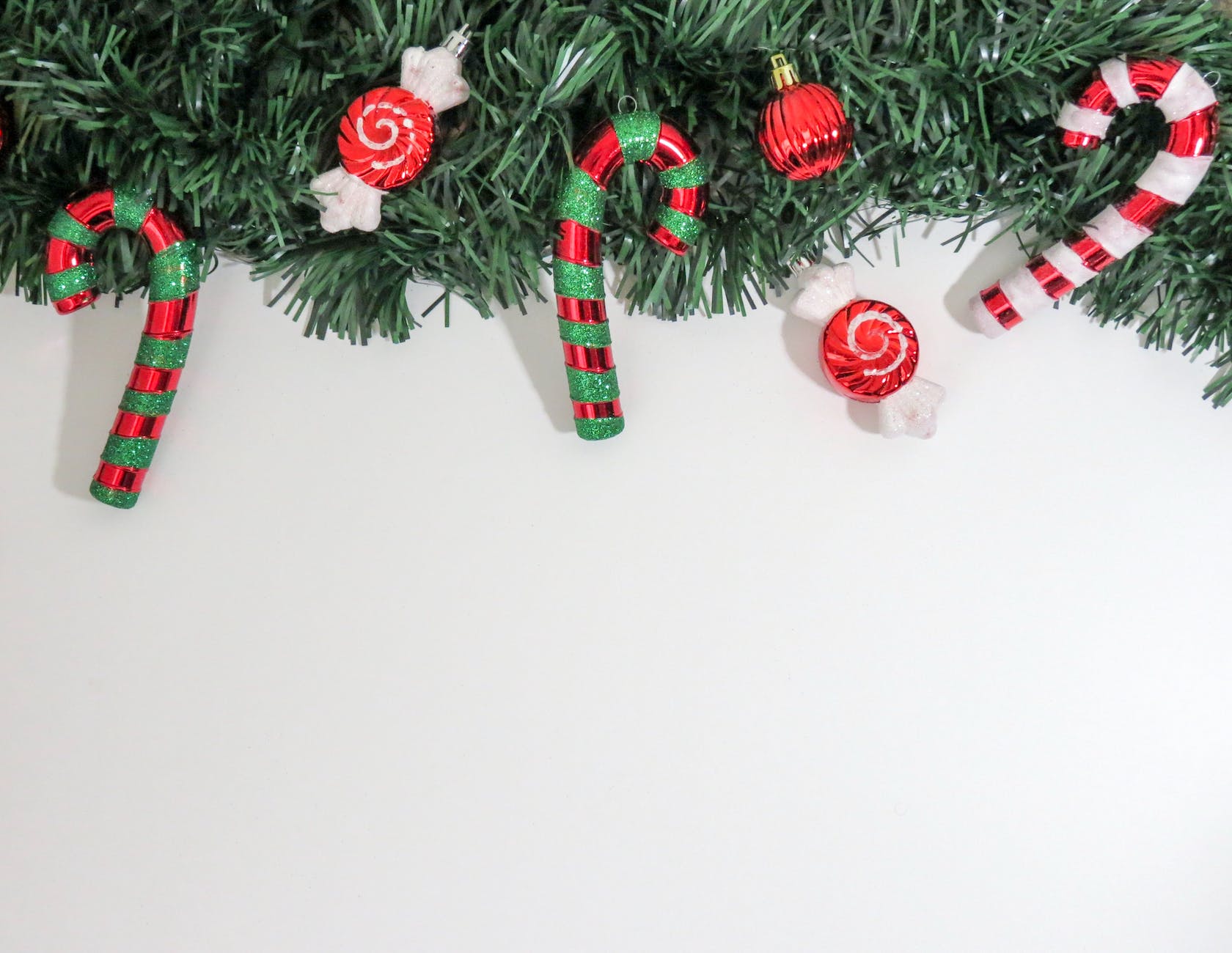 close up of christmas decorations hanging on tree